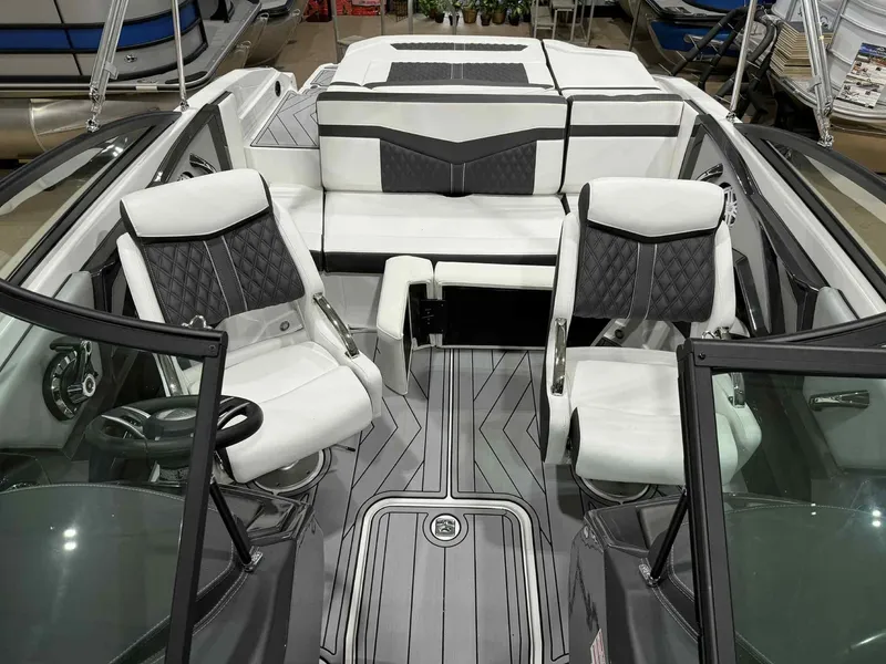 Slide: The Image of 2025 Monterey 218 SS boat interior with sleek seating and modern design. - 15