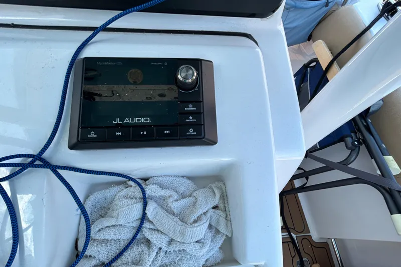 Slide: The Image of Control panel on a 2018 Sportsman 282 boat with JL Audio system and blue rope. - 10