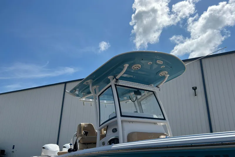 Slide: The Image of 2018 Sportsman 282 boat with T-top against blue sky and clouds. - 33