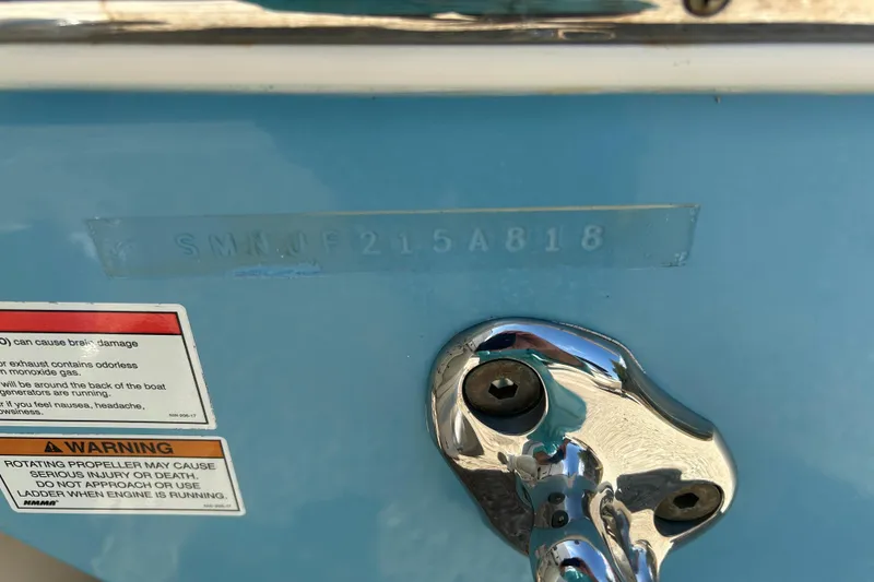 Slide: The Image of Close-up of a 2018 Sportsman 282 boat hull with warning label and metal fitting. - 35