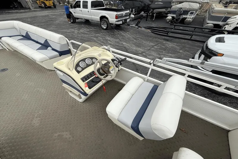 Slide: The Image of 2005 Bentley Pontoons 240 CRUISE interior with steering console and seating. - 5