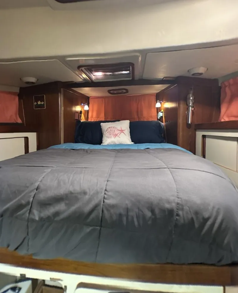 Slide: The Image of Cozy cabin interior of 1986 Irwin 43 Mk II Cruiser with comfortable bedding. - 10