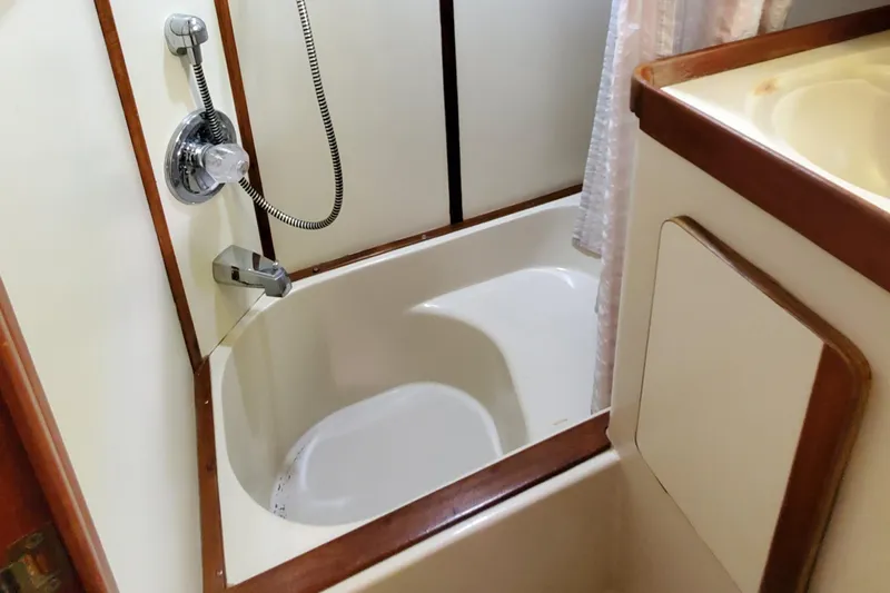 Slide: The Image of 1986 Irwin 43 Mk II Cruiser bathroom with bathtub and shower fixtures. - 13