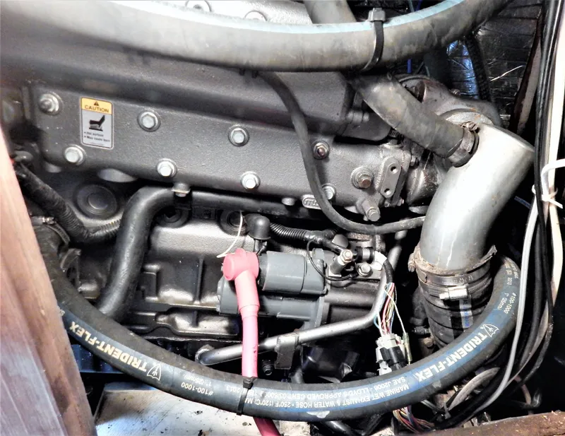 Slide: The Image of Engine compartment of a 1986 Irwin 43 Mk II Cruiser with visible hoses and components. - 15