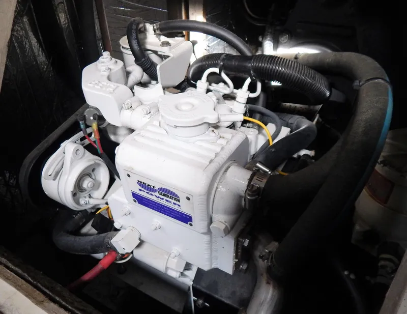 Slide: The Image of Engine of 1986 Irwin 43 Mk II Cruiser, featuring hoses and mechanical components. - 16