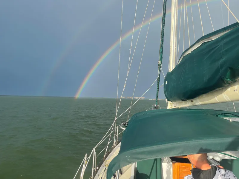 Slide: The Image of Sailboat on open water with double rainbow, Irwin 43 Mk II Cruiser, 1986 model. - 26