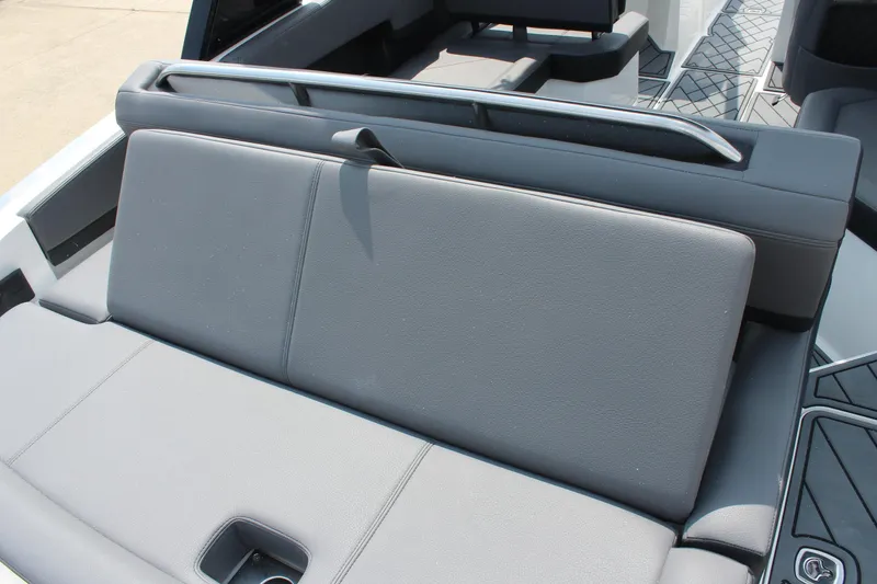 Slide: The Image of 2026 Cobalt R4 boat interior with gray cushioned seating and sleek design. - 10