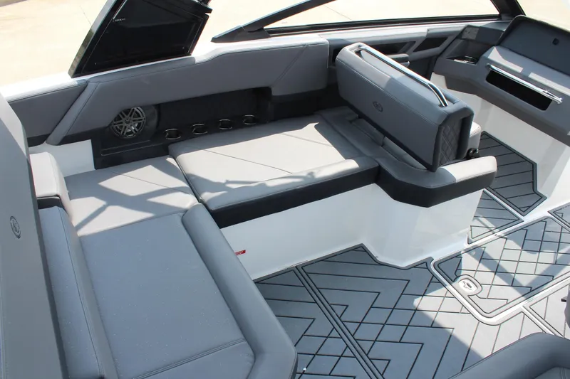 Slide: The Image of 2026 Cobalt R4 boat interior with sleek gray seating and modern design elements. - 12