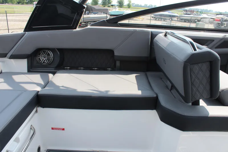 Slide: The Image of 2026 Cobalt R4 boat interior with gray seating and speaker detail. - 13