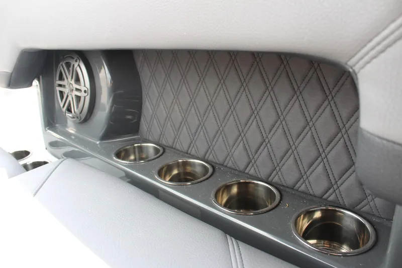 Slide: The Image of 2026 Cobalt R4 interior with quilted panel, speaker, and cup holders. - 17