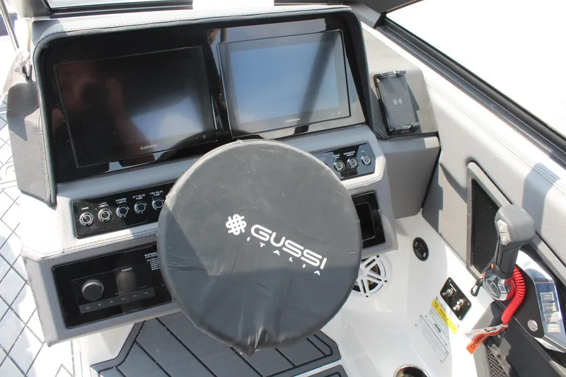 Slide: The Image of 2026 Cobalt R4 boat dashboard with dual screens and Gussi Italia steering wheel. - 23