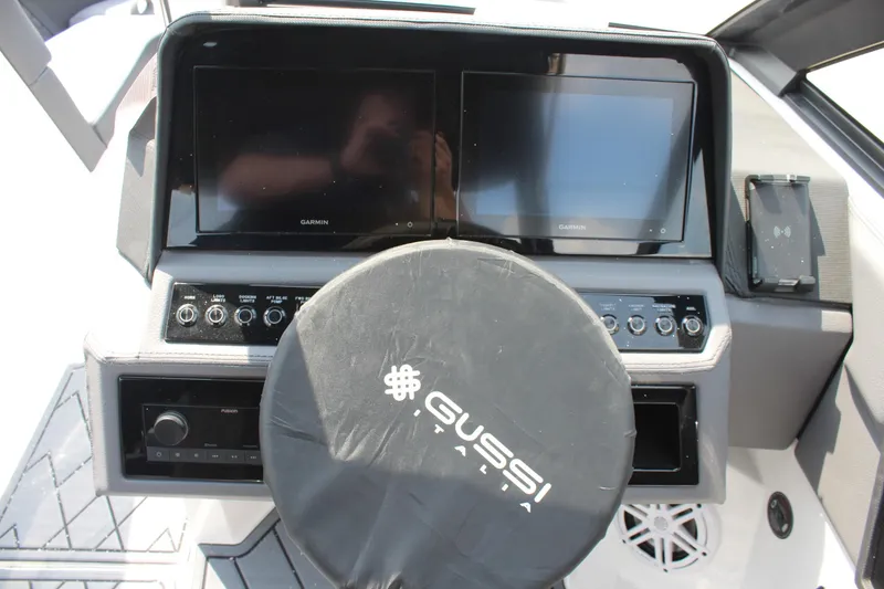 Slide: The Image of 2026 Cobalt R4 boat dashboard with dual Garmin screens and Gussi Italia steering wheel. - 24