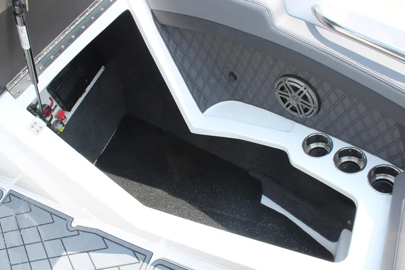 Slide: The Image of Interior of 2026 Cobalt R4 boat featuring cup holders and speaker. - 30