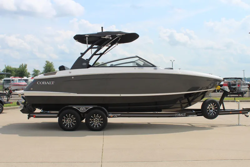 Slide: The Image of 2026 Cobalt R4 boat on trailer, sleek design, parked outdoors. - 5