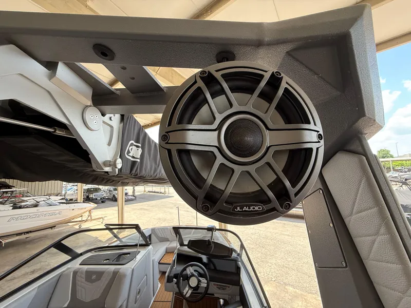 Slide: The Image of 2022 Nautique Super Air G23 with JL Audio speaker, showcasing premium sound system. - 13