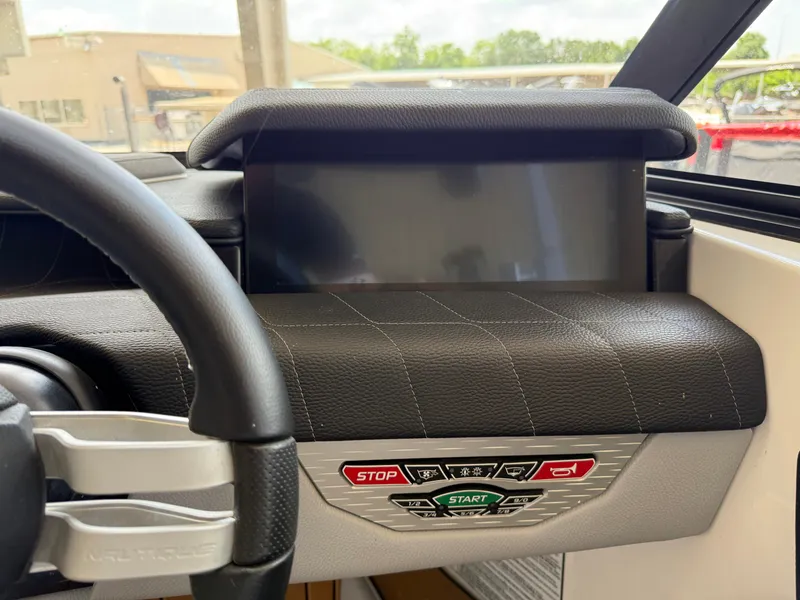 Slide: The Image of 2022 Nautique Super Air G23 dashboard with touchscreen and control buttons. - 20