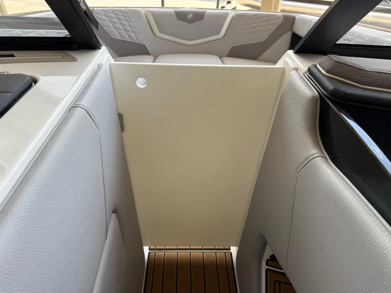 Slide: The Image of 2022 Nautique Super Air G23 interior with sleek seating and modern design elements. - 24