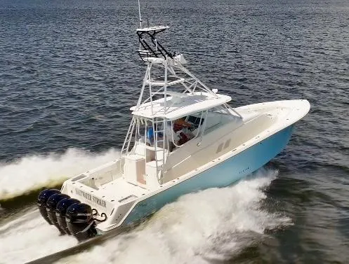 Slide: The Image of 2016 SeaVee 430 Fish Around boat cruising on open water with four powerful engines. - 1