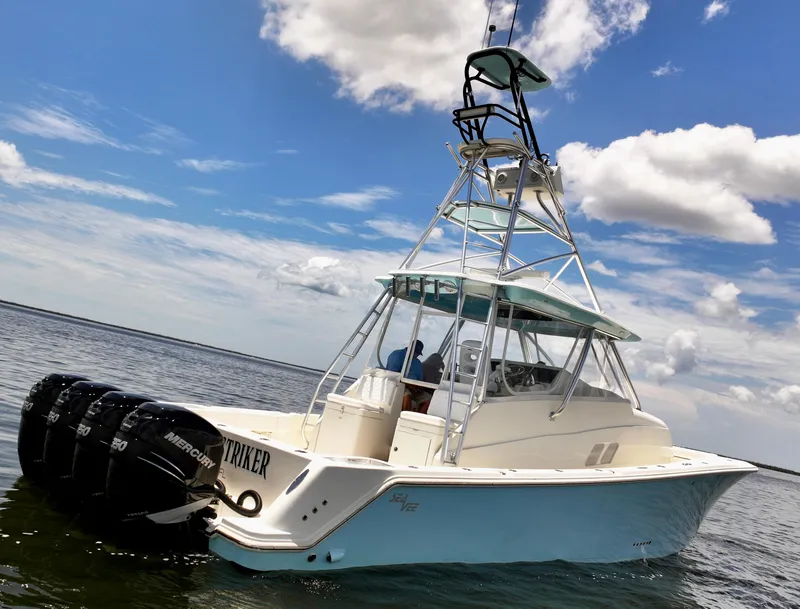Slide: The Image of 2016 SeaVee 430 Fish Around boat with multiple outboard motors on a sunny day. - 19
