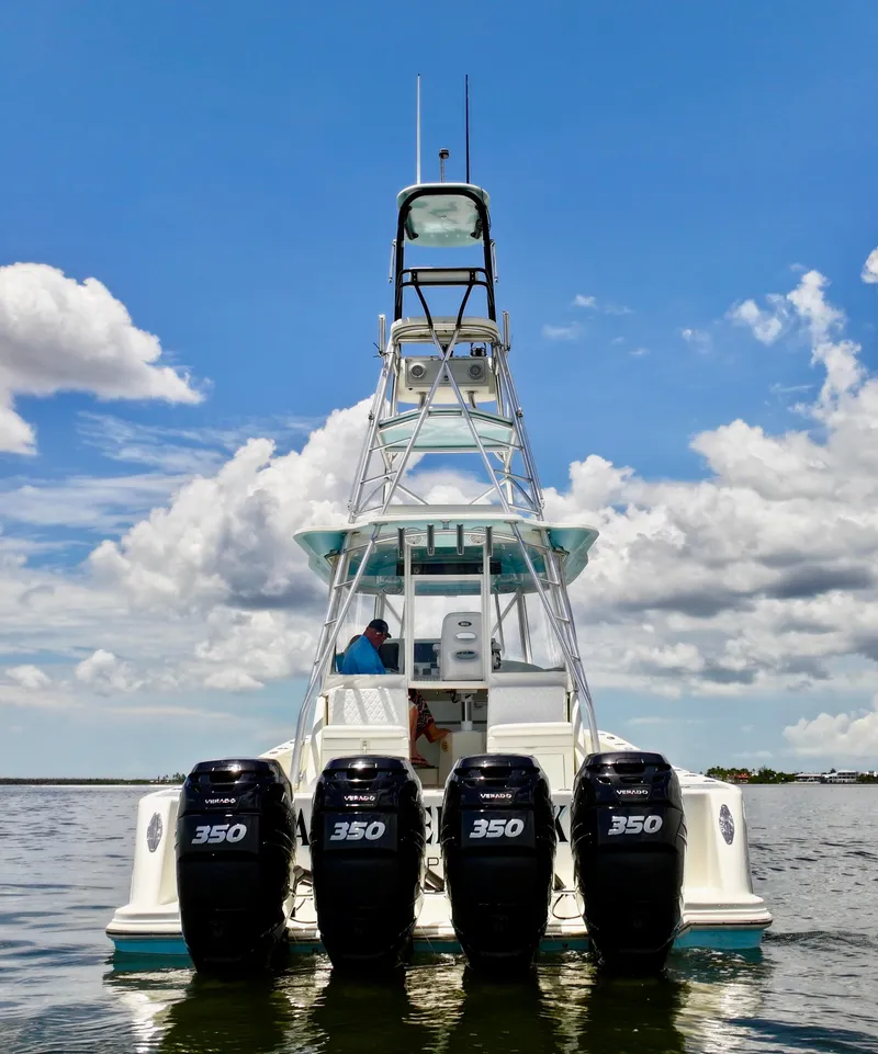 Slide: The Image of 2016 SeaVee 430 Fish Around boat with four powerful engines on open water. - 21