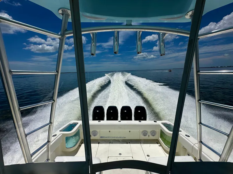 Slide: The Image of 2016 SeaVee 430 Fish Around boat cruising on open water, leaving a wake behind. - 8