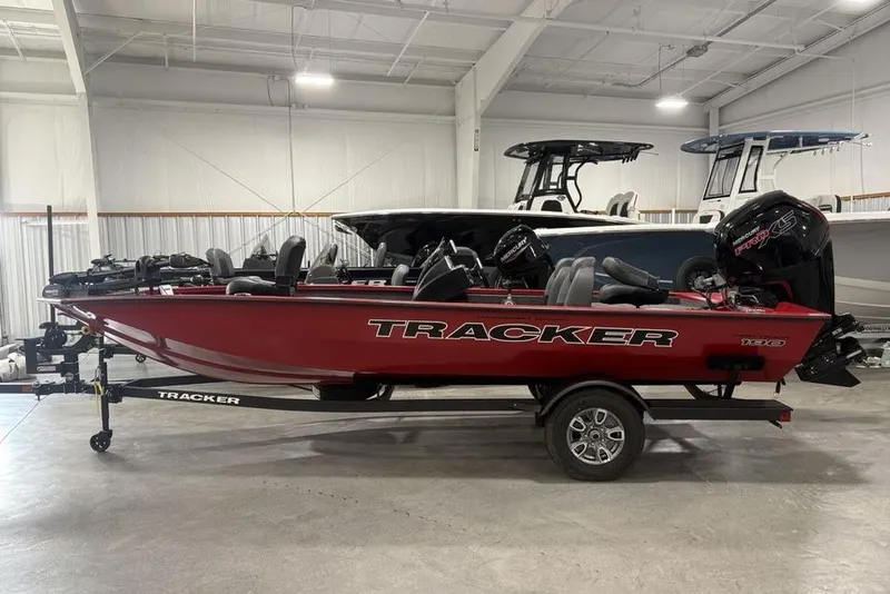 The Image of 2025 Tracker Pro Team™ 190 boat in showroom, red exterior, on trailer. - 0