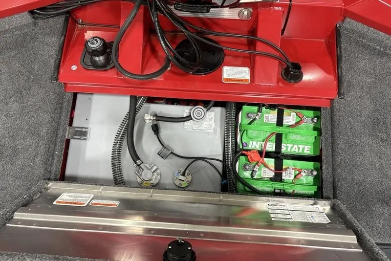 Slide: The Image of 2025 Tracker Pro Team™ 190 boat battery compartment with Interstate batteries and wiring. - 27