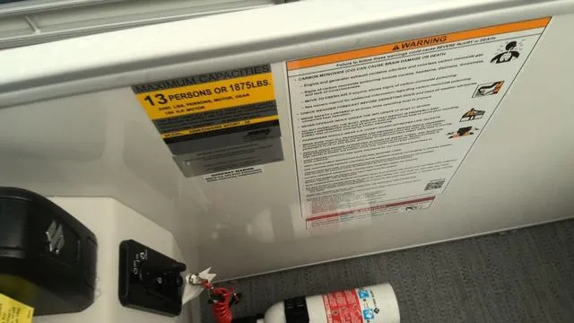 Slide: The Image of 2025 Godfrey Pontoons Xperience 2286 SBX capacity and safety labels, maximum 13 persons or 1,675 lbs. - 10