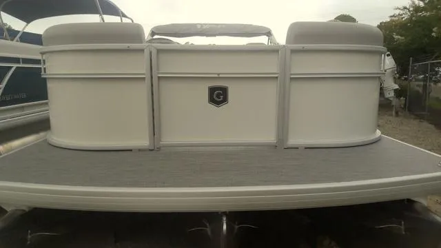Slide: The Image of 2025 Godfrey Pontoons Xperience 2286 SBX Sport Tube, rear view on water. - 2