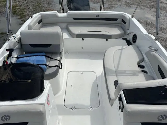 Slide: The Image of 2022 Hurricane SunDeck Sport 185 OB boat interior with seating and storage. - 11