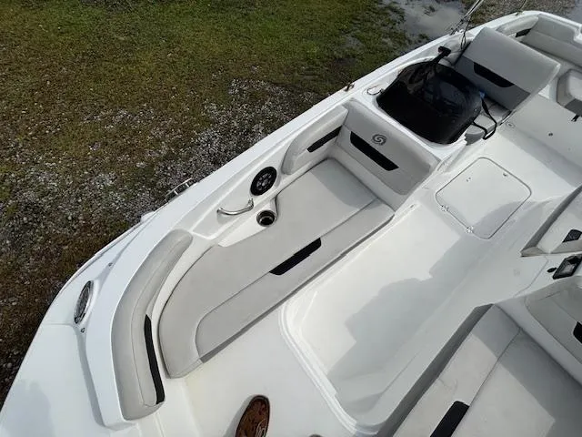 Slide: The Image of 2022 Hurricane SunDeck Sport 185 OB boat interior with seating and storage compartments. - 12
