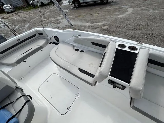 Slide: The Image of 2022 Hurricane SunDeck Sport 185 OB interior with seating and cup holders. - 15
