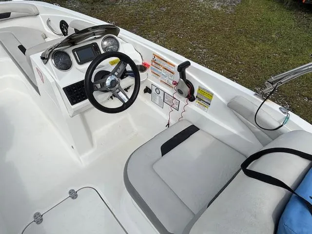 Slide: The Image of 2022 Hurricane SunDeck Sport 185 OB boat interior with steering wheel and seating. - 18