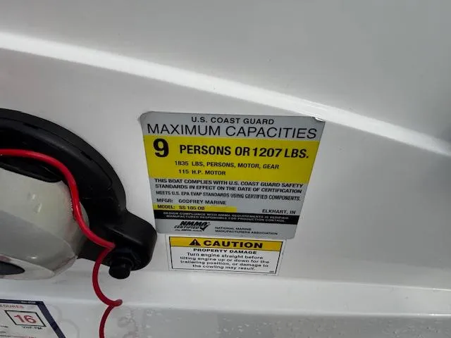 Slide: The Image of U.S. Coast Guard capacity label on 2022 Hurricane SunDeck Sport 185 OB, 9 persons or 1207 lbs. - 19