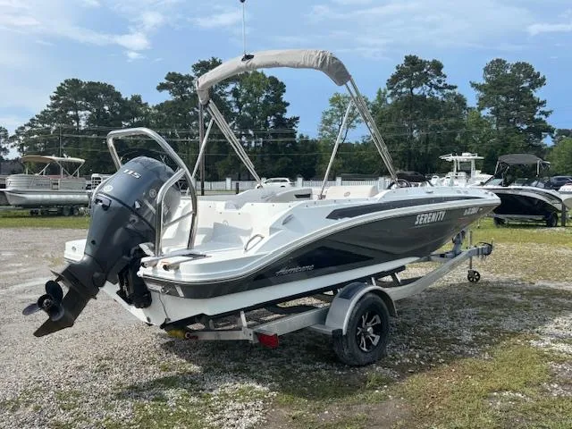 Slide: The Image of 2022 Hurricane SunDeck Sport 185 OB boat on trailer, parked outdoors. - 4