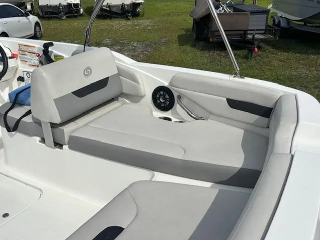Slide: The Image of 2022 Hurricane SunDeck Sport 185 OB boat interior with gray seating and speaker. - 8
