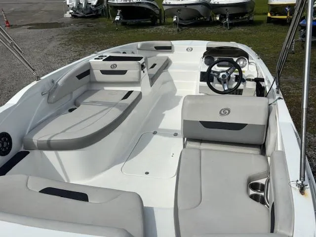 Slide: The Image of 2022 Hurricane SunDeck Sport 185 OB boat interior with seating and steering wheel. - 9
