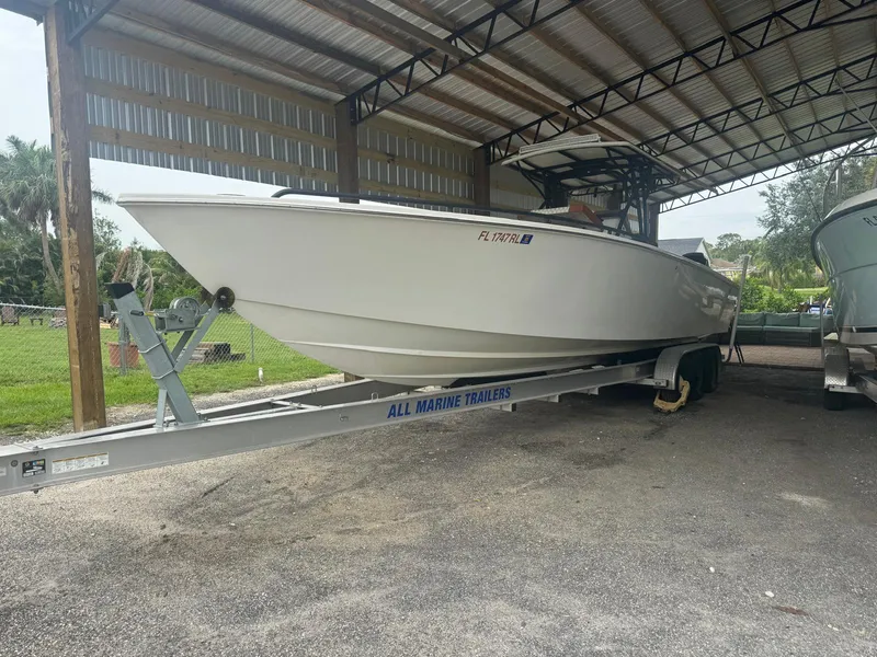 Slide: The Image of 2008 Avanti 36 boat on trailer under sunny sky. - 1