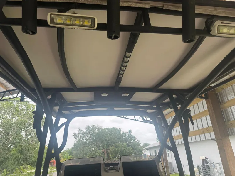 Slide: The Image of Open storage compartment on 2008 Avanti 36 boat with visible rust stains. - 19