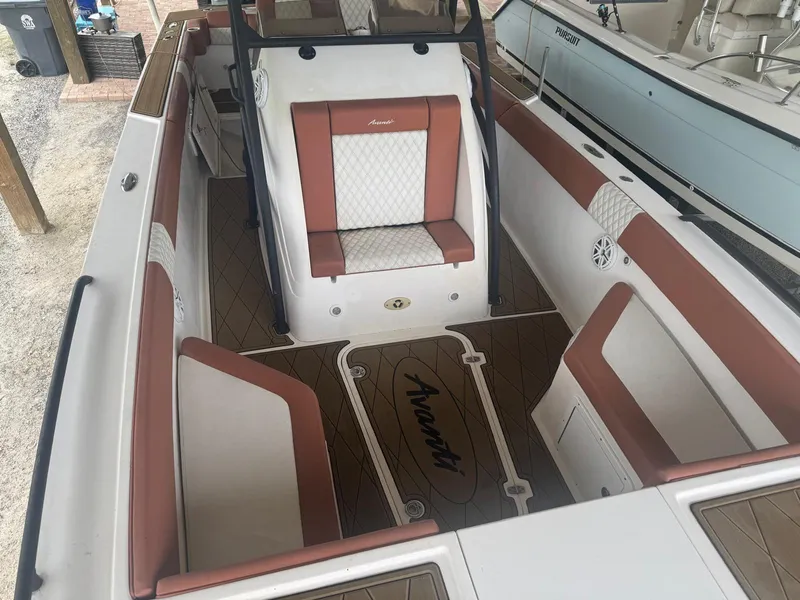 Slide: The Image of 2008 Avanti 36 boat on trailer under metal shelter. - 26