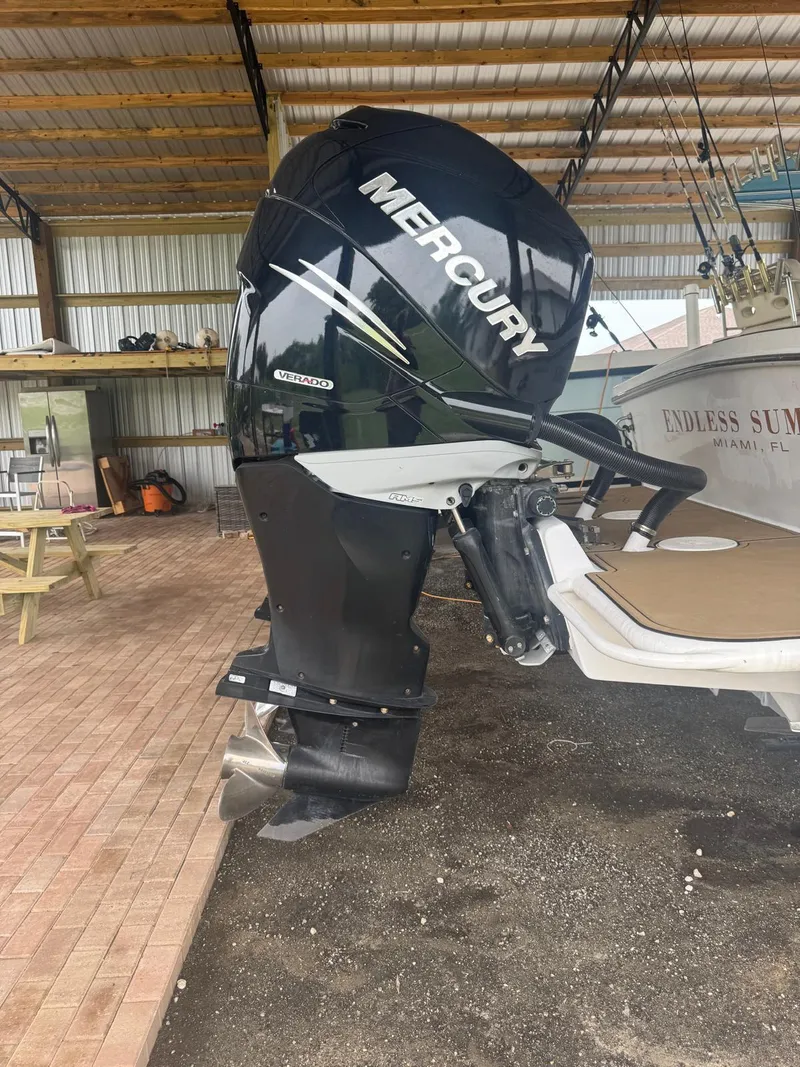 Slide: The Image of 2008 Avanti 36 boat with dual Mercury outboard engines in a sunny outdoor setting. - 4