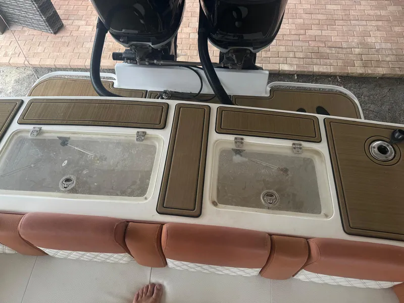 Slide: The Image of 2008 Avanti 36 boat interior with cushioned seating and storage compartments. - 7