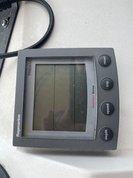 Slide: The Image of Raymarine display on 2003 Mainship Pilot 30-II boat, showing speed, depth, and trip data. - 2