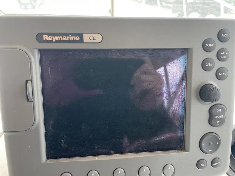 Slide: The Image of Raymarine C80 navigation system on 2003 Mainship Pilot 30-II boat dashboard. - 3