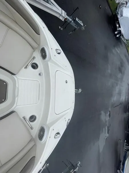 Slide: The Image of 2012 Sea Ray 260 Sundeck boat on trailer, top view, showcasing seating and deck layout. - 8