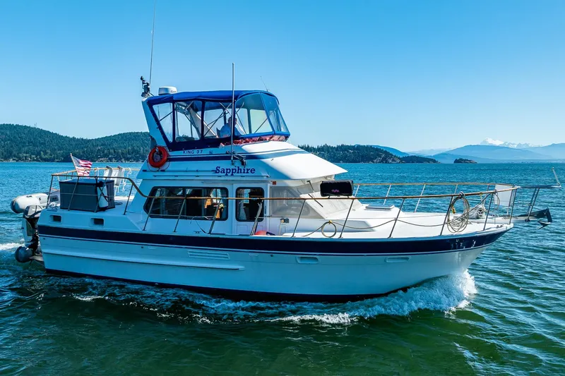 Slide: The Image of 1986 Kha Shing 37' yacht "Sapphire" cruising on a sunny day, scenic background. - 0