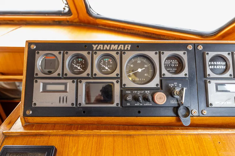 Slide: The Image of Control panel of a 1986 Kha Shing 37' boat with Yanmar gauges and controls. - 24