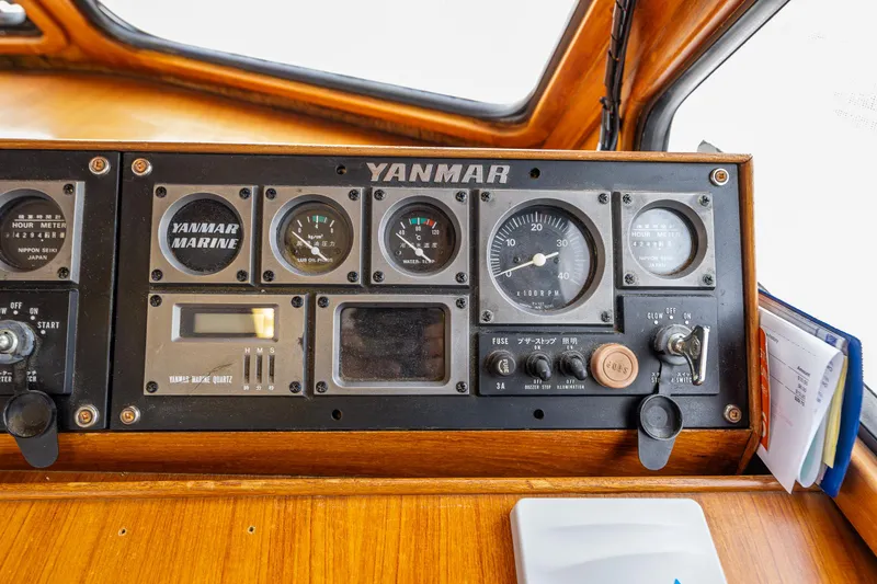 Slide: The Image of Control panel of a 1986 Kha Shing 37' boat with Yanmar marine gauges. - 25