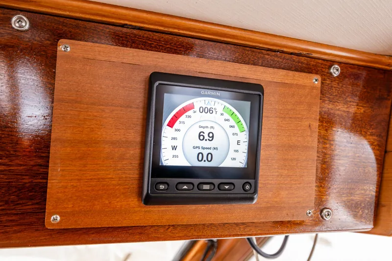 Slide: The Image of Garmin marine display on 1986 Kha Shing 37' boat, showing depth and GPS speed. - 26