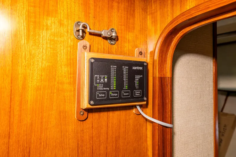 Slide: The Image of Control panel on 1986 Kha Shing 37' yacht with wooden interior. - 32